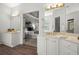 Bathroom boasts dual sinks, and a view into the primary bedroom at 1050 Shady Valley Pl, Atlanta, GA 30324