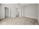 Spacious carpeted bedroom with ample natural light, closet, and open doorway leading to a bathroom at 1050 Shady Valley Pl, Atlanta, GA 30324