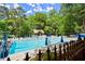 Community pool with many chairs, umbrellas and a cabana at 1050 Shady Valley Pl, Atlanta, GA 30324
