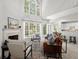 Bright living room features a fireplace, vaulted ceilings, and lots of natural light at 1050 Shady Valley Pl, Atlanta, GA 30324