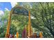 Shady Valley Park sign with yellow sunflowers, climbing structure, and trees at 1050 Shady Valley Pl, Atlanta, GA 30324
