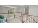 Upstairs landing area with view of the staircase and backyard at 1050 Shady Valley Pl, Atlanta, GA 30324