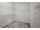 Walk-in closet with wire shelving and carpeted floors provides ample storage space at 1050 Shady Valley Pl, Atlanta, GA 30324