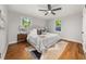 Comfortable bedroom with a ceiling fan, hardwood flooring, and bright natural light at 2272 Desmond Dr, Decatur, GA 30033