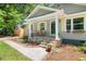 Inviting covered front porch with stone steps and decorative flower boxes at 2272 Desmond Dr, Decatur, GA 30033