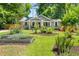 Charming single-story home with a well-manicured lawn and vibrant garden beds at 2272 Desmond Dr, Decatur, GA 30033