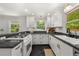 Modern kitchen featuring white cabinets, granite countertops, and stainless steel appliances at 2272 Desmond Dr, Decatur, GA 30033