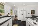 Modern kitchen featuring white cabinets, granite countertops, and stainless steel appliances at 2272 Desmond Dr, Decatur, GA 30033