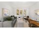 Inviting living room featuring a comfortable sofa, stylish chairs, and hardwood flooring at 2272 Desmond Dr, Decatur, GA 30033