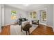 Bright living room boasts ample natural light, hardwood floors, and stylish decor at 2272 Desmond Dr, Decatur, GA 30033