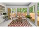 Bright sun room with tile floors, sliding glass doors, and charming decor create a tranquil, inviting space at 2272 Desmond Dr, Decatur, GA 30033