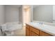 This bathroom features a bathtub, shower, toilet, vanity with sink, and tile flooring at 4544 Parkview Sq, Atlanta, GA 30349