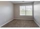 Sunny bedroom featuring neutral walls, comfortable carpeting, and natural light at 4544 Parkview Sq, Atlanta, GA 30349