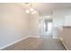 Neutral carpet and light-colored walls create an inviting dining room space at 4544 Parkview Sq, Atlanta, GA 30349