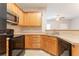Modern kitchen featuring updated stainless steel appliances, lots of counter space, and nice wood cabinets at 4544 Parkview Sq, Atlanta, GA 30349