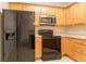 Beautiful modern kitchen, with lots of storage, featuring stainless steel appliances and light wood cabinets at 4544 Parkview Sq, Atlanta, GA 30349
