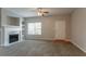 Open living room featuring a fireplace, large window, and a welcoming entrance at 4544 Parkview Sq, Atlanta, GA 30349