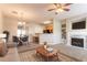 Inviting living room boasts a fireplace, plush carpet, and seamlessly blends into dining at 4544 Parkview Sq, Atlanta, GA 30349