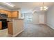 This open layout features the kitchen as well as living spaces featuring carpet and lots of light at 4544 Parkview Sq, Atlanta, GA 30349