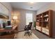 Cozy home office with built-in shelving, work space, and comfortable chair at 4544 Parkview Sq, Atlanta, GA 30349