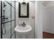 Elegant bathroom featuring a pedestal sink, subway tile, and a glass-enclosed shower at 75 Ponce De Leon Ave # 701, Atlanta, GA 30308