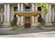 Elegant building entrance featuring ornate columns and a decorative awning for a grand arrival at 75 Ponce De Leon Ave # 701, Atlanta, GA 30308