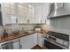 Modern kitchen with stainless steel appliances, butcher block countertops, and shaker cabinets at 75 Ponce De Leon Ave # 701, Atlanta, GA 30308
