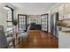 Bright living space with open kitchen and dining area featuring hardwood floors at 75 Ponce De Leon Ave # 701, Atlanta, GA 30308