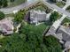Aerial view displays lush tree coverage surrounding the property, enhancing privacy and natural beauty at 106 Twilight Overlook, Canton, GA 30114