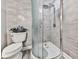 Bathroom featuring a corner shower with glass enclosure and decorative tile at 106 Twilight Overlook, Canton, GA 30114