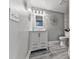 Well-lit bathroom with a modern vanity, decorative mirrors, and stylish tile flooring at 106 Twilight Overlook, Canton, GA 30114