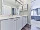 Bathroom with white vanity, dual sinks and a view of a bedroom with natural light at 106 Twilight Overlook, Canton, GA 30114
