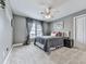 Cozy bedroom featuring a plush bed, soft carpet, and neutral gray walls with natural light at 106 Twilight Overlook, Canton, GA 30114