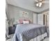 Comfortable bedroom with a queen-sized bed, carpeted floor and ceiling fan for comfort at 106 Twilight Overlook, Canton, GA 30114