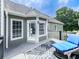 Outdoor deck with a blue chaise lounge, decorative rug and view of the home's exterior at 106 Twilight Overlook, Canton, GA 30114