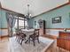 Sophisticated dining room with a large window, elegant chandelier, and hardwood flooring at 106 Twilight Overlook, Canton, GA 30114