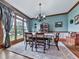Elegant dining room features a chandelier, wainscoting, and a large window at 106 Twilight Overlook, Canton, GA 30114