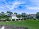 Well-maintained homes showcase lush landscaping and manicured lawns under a beautiful sky at 106 Twilight Overlook, Canton, GA 30114