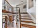 View of the foyer with staircase and wrought iron railing at 106 Twilight Overlook, Canton, GA 30114
