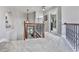 Upstairs hallway with carpeted floor and wrought iron railing at 106 Twilight Overlook, Canton, GA 30114