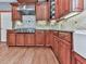 Modern kitchen features tile backsplash, granite countertops, and stainless-steel range at 106 Twilight Overlook, Canton, GA 30114