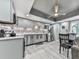 Renovated kitchen featuring stainless steel appliances, gray cabinets, and patterned backsplash at 106 Twilight Overlook, Canton, GA 30114
