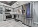 Updated kitchen featuring stainless steel appliances, gray cabinets, and decorative backsplash at 106 Twilight Overlook, Canton, GA 30114