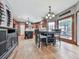 Open kitchen and dining area featuring hardwood floors and access to the outdoor patio at 106 Twilight Overlook, Canton, GA 30114