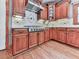 Well-equipped kitchen with custom cabinetry, granite countertops, and stainless steel appliances at 106 Twilight Overlook, Canton, GA 30114