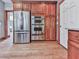 Modern kitchen features stainless steel appliances, wood cabinets and hardwood floors at 106 Twilight Overlook, Canton, GA 30114
