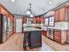 Modern kitchen with stainless steel appliances, an island, and cherry wood cabinets at 106 Twilight Overlook, Canton, GA 30114