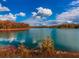 Picturesque view of the lake surrounded by colorful fall foliage, showcasing natural beauty at 106 Twilight Overlook, Canton, GA 30114