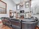Inviting living room featuring hardwood floors, a stone fireplace, and a mounted television at 106 Twilight Overlook, Canton, GA 30114