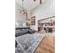 Open-concept living room showcasing hardwood floors and seamless transition to the kitchen at 106 Twilight Overlook, Canton, GA 30114
